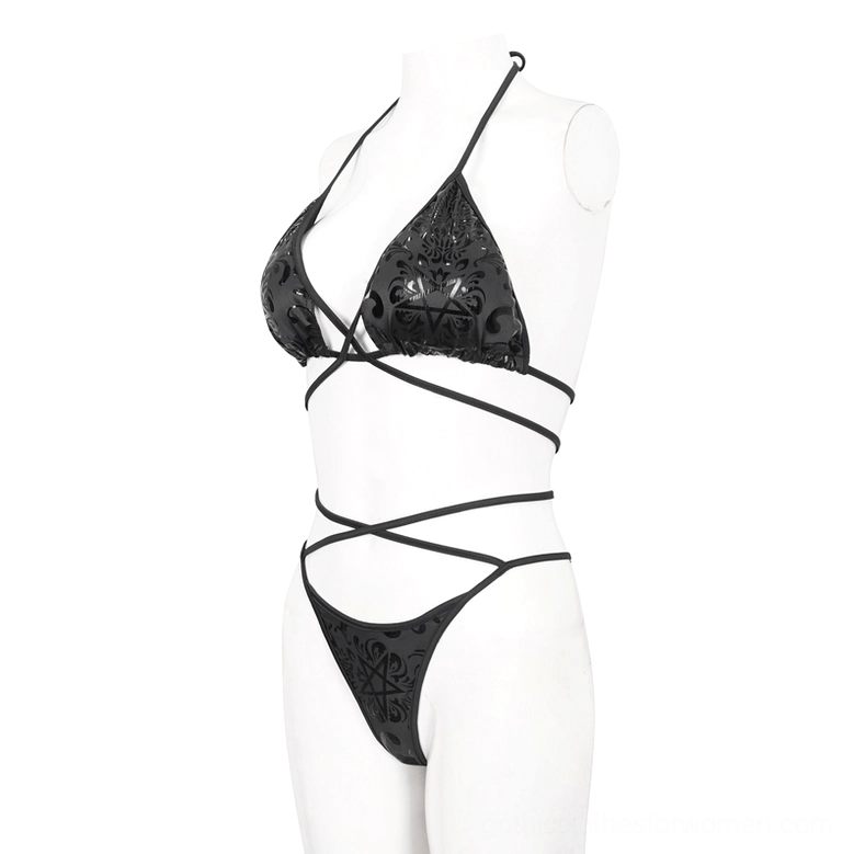 Gothic bikini set side-front angle on mannequin featuring halter triangle top with embossed occult motifs and architectural strap design