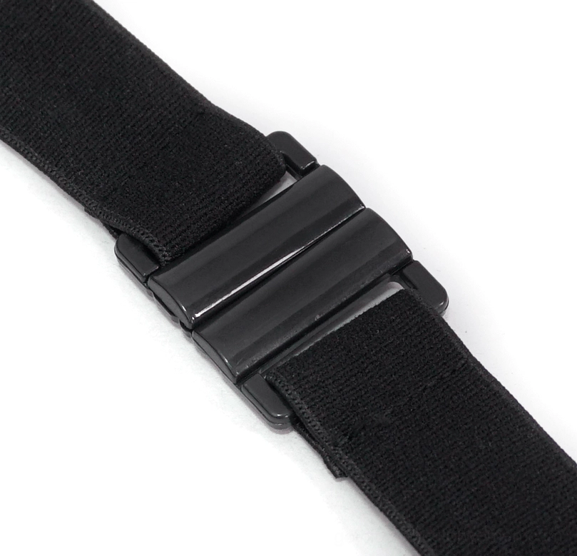Top-down close-up of gothic bikini strap fastener showing matte black metal buckle attachment mechanism