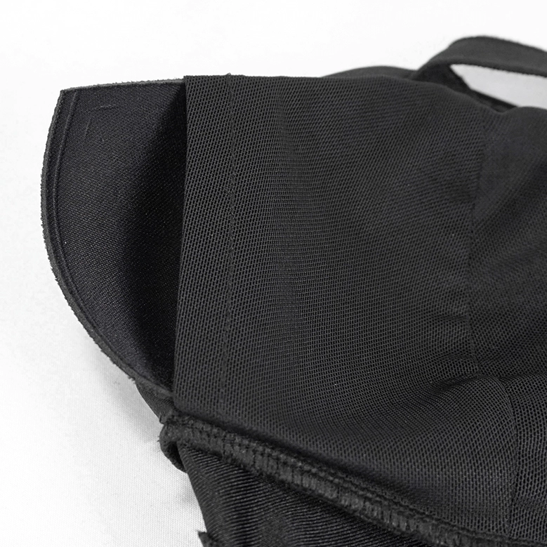Close-up macro view of matte black satin bikini top fabric showing seam quality and finish