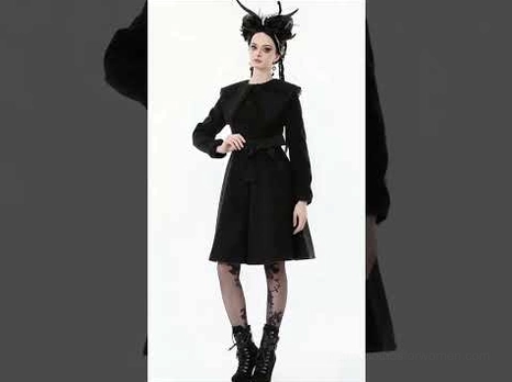 Three-quarter front angle view of gothic black coat with intricate lace collar worn by model with gothic styling