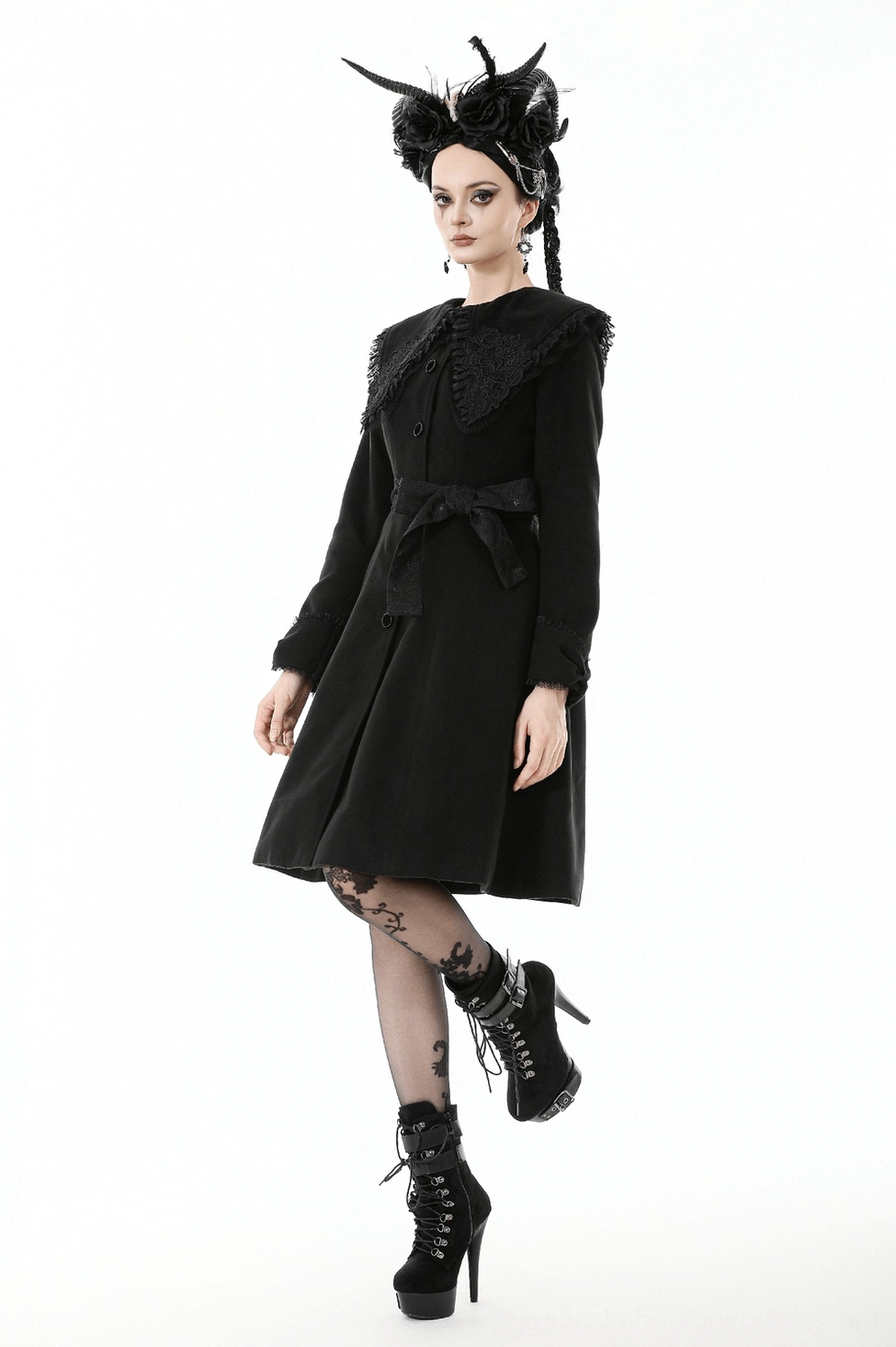 Side view of victorian gothic black coat displaying fitted waist, A-line hem, and tailored structure