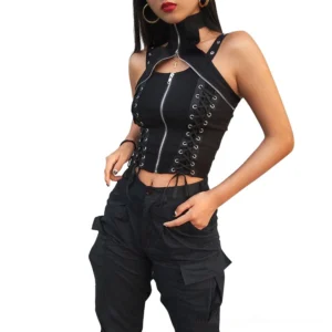 Black gothic crop corset tank top with rivet straps and front zipper, worn by female model in studio setting, featuring halter neckline and side lace-up details