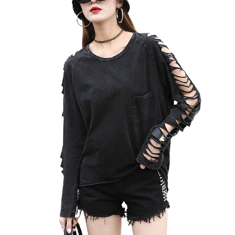 Black gothic cutout long sleeve tee front three-quarter view on fashion model showcasing distressed lattice sleeve details and o-neck design
