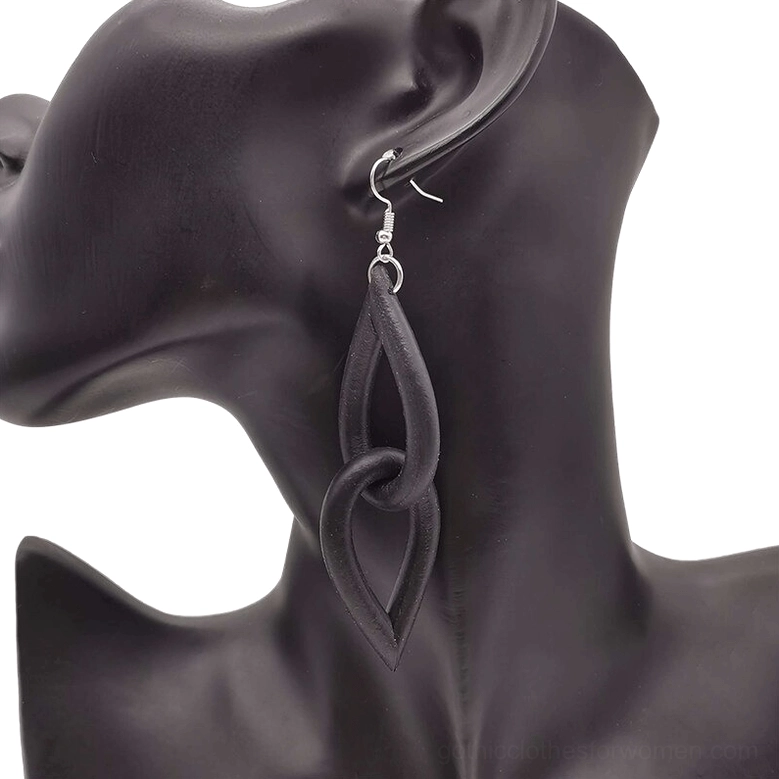 Black gothic dangle earrings on dark mannequin bust from back angle, highlighting dark matte finish and twisted interlocking link architecture