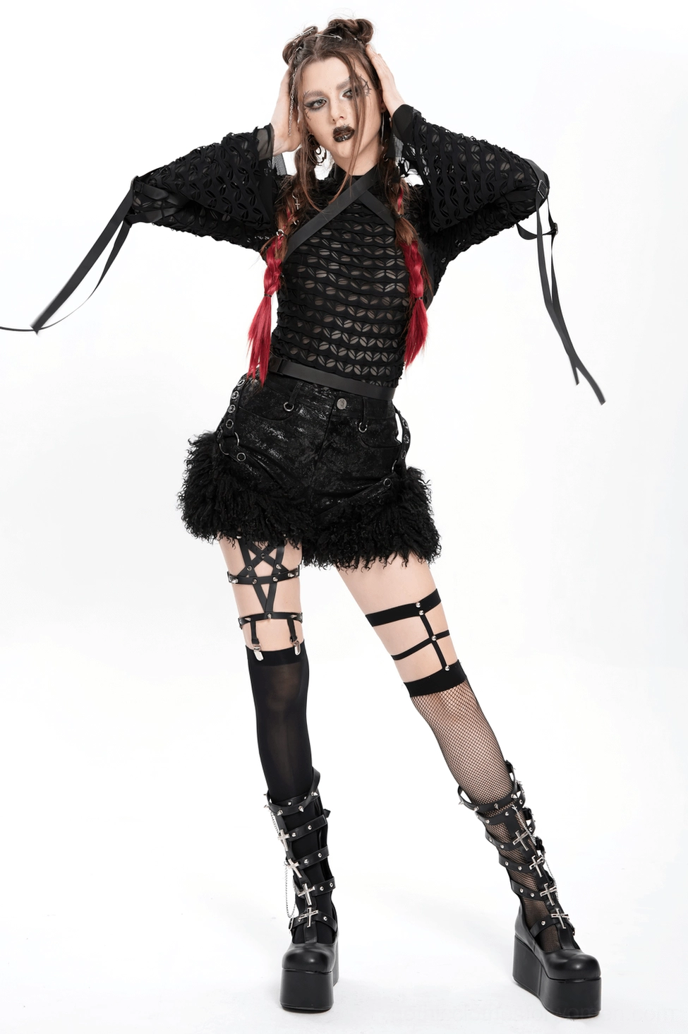 Model posing in black gothic faux leather shorts with fur trim showing movement and fit demonstration