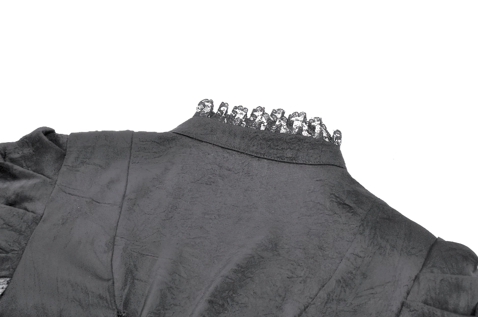 Macro close-up of black gothic dress bell-sleeve showing multi-layered sheer tulle lace, mesh fabric, and finished lace edging