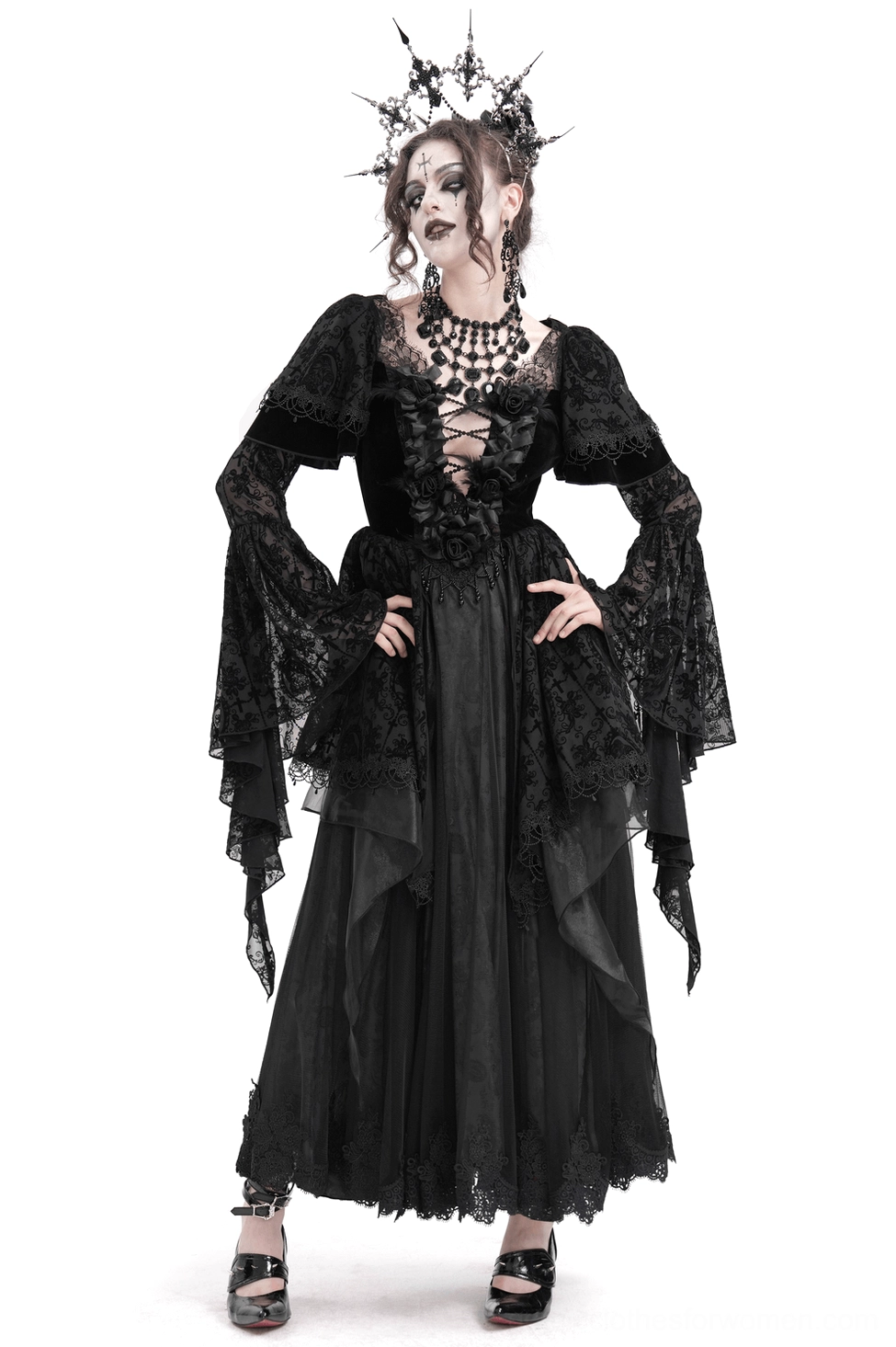 Black Victorian gothic lace maxi dress with dramatic bell sleeves, front lace-up bodice, and ornate lace detailing worn by model in studio setting