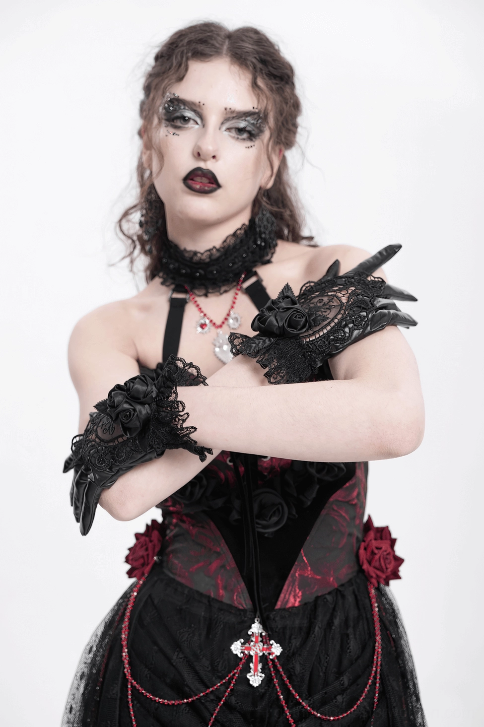 Gothic black lace gloves showing wrist circumference fit and elegant drape