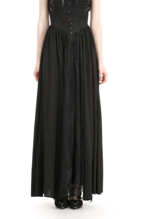 Black lace high-waist maxi skirt front view, showing intricate lace overlay, button accents, and flowing A-line silhouette on female model