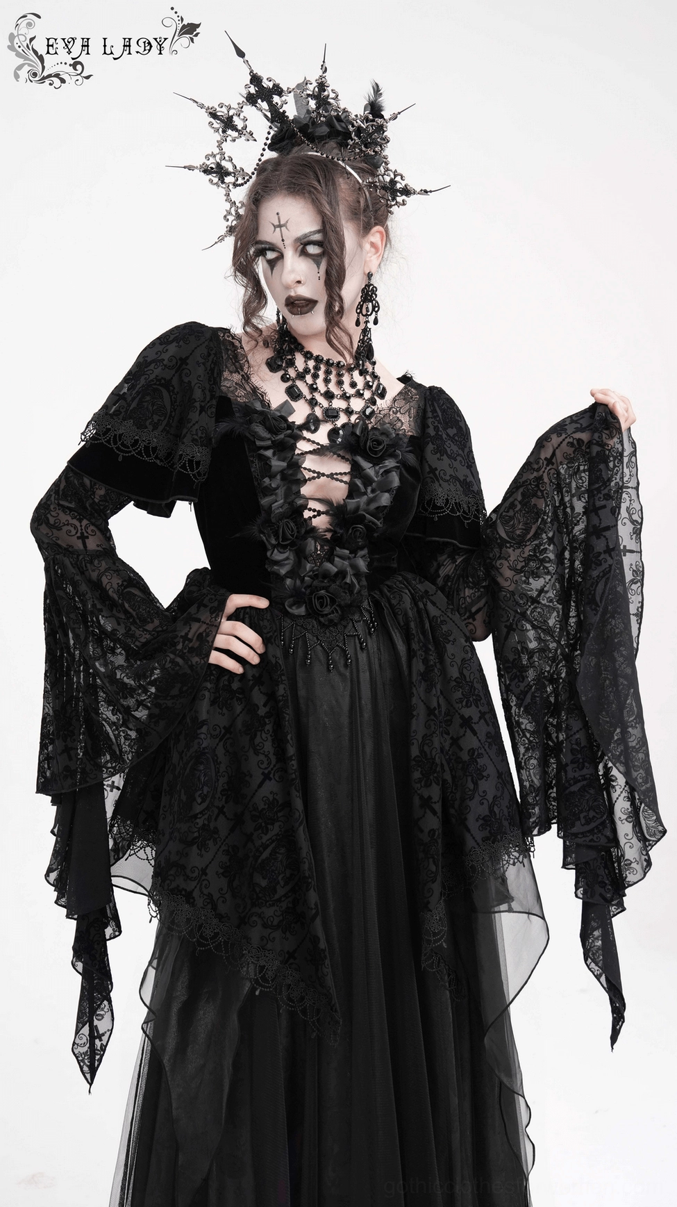 Black gothic maxi dress front view displaying bell sleeves, lace bodice detailing, and floor-length layered skirt construction