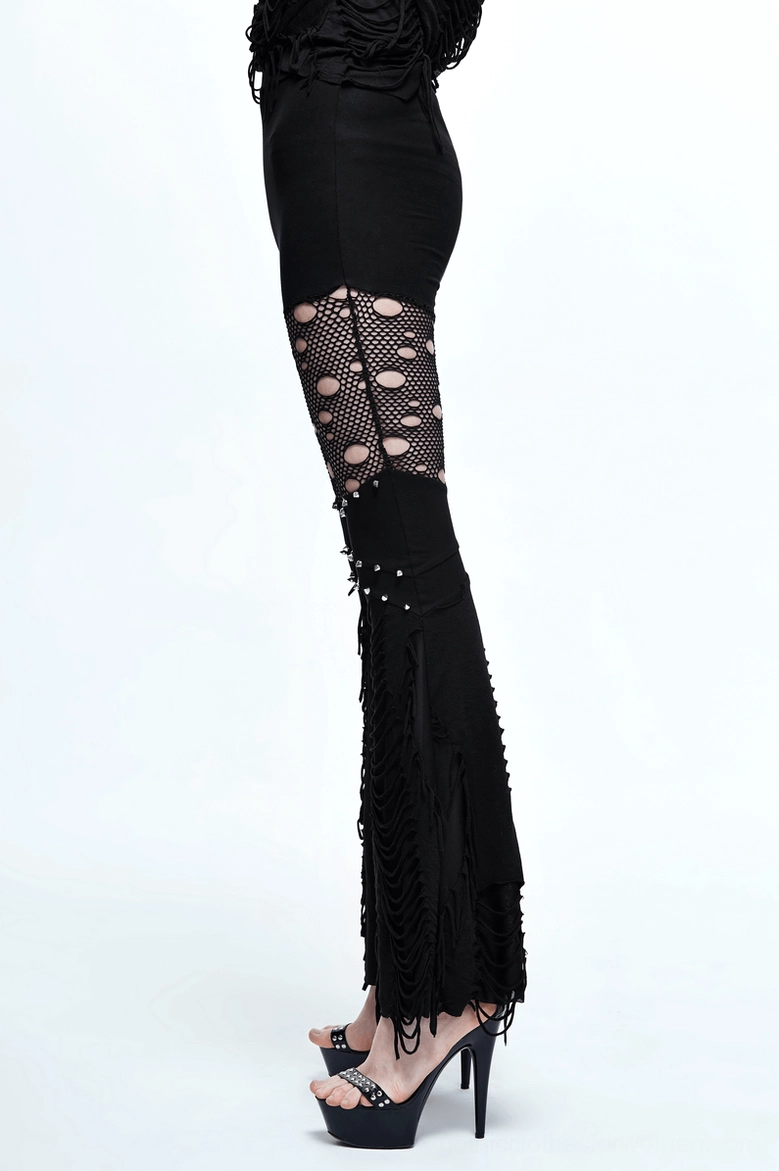 Gothic black pants with fishnet cutouts and stud embellishments - styling reference