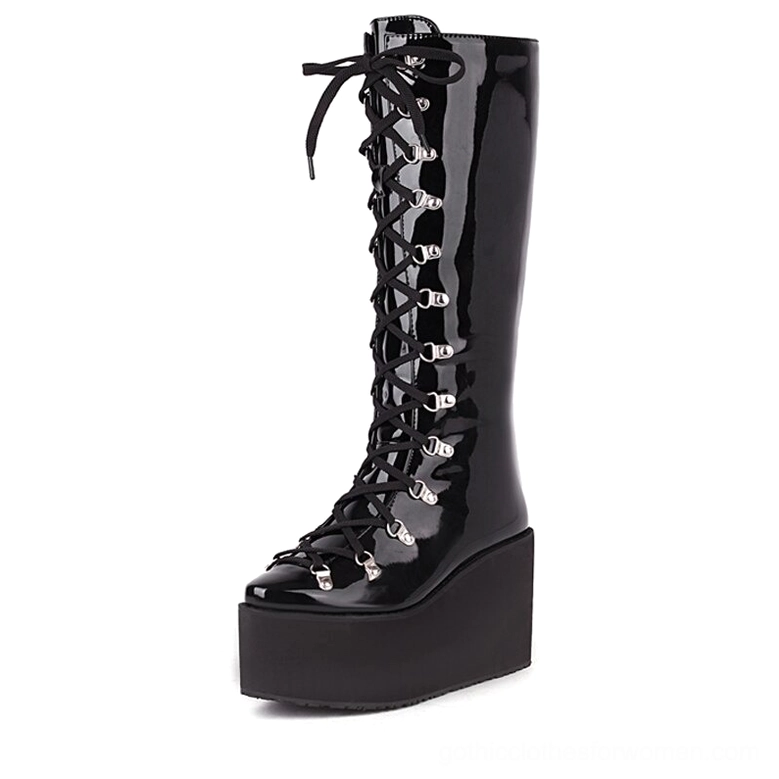 Gothic black patent leather platform boots front view with lace-up detail and metal eyelets