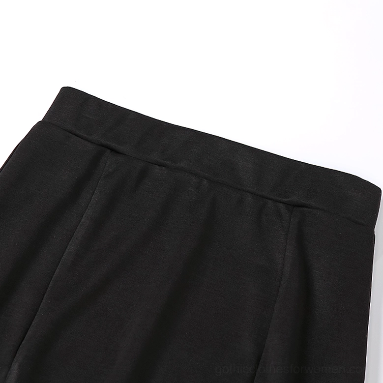 High-waist gothic black midi skirt detail focus on fabric stretch and fit quality