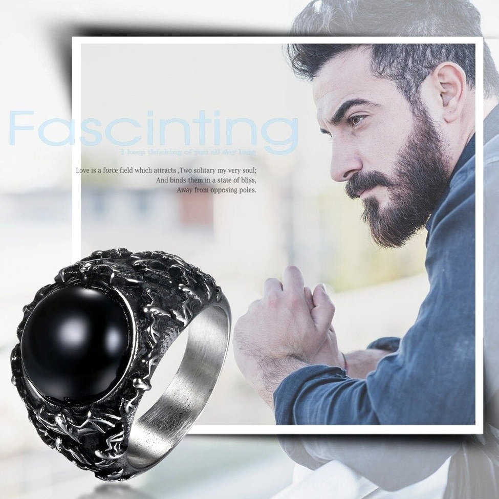 Black onyx gothic ring worn on male model hand showing real-world styling and scale in casual setting