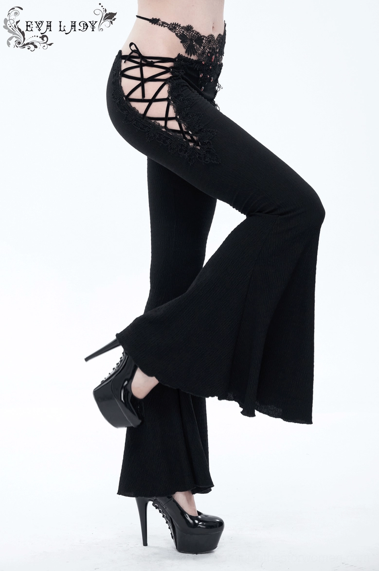 Detailed styling shot of gothic black trousers highlighting lace appliqué and alternative fashion aesthetic