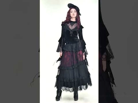 Full-body model shot of gothic black velvet bell sleeve top with dramatic flared sleeves and fitted bodice