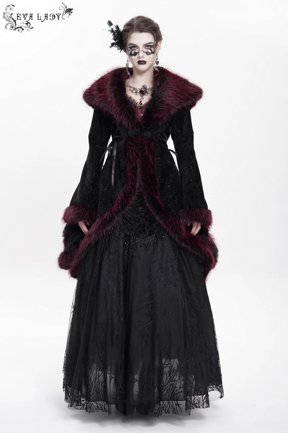 Flat lay showing interior or construction details of black velvet gothic coat, revealing quality craftsmanship and fabric composition