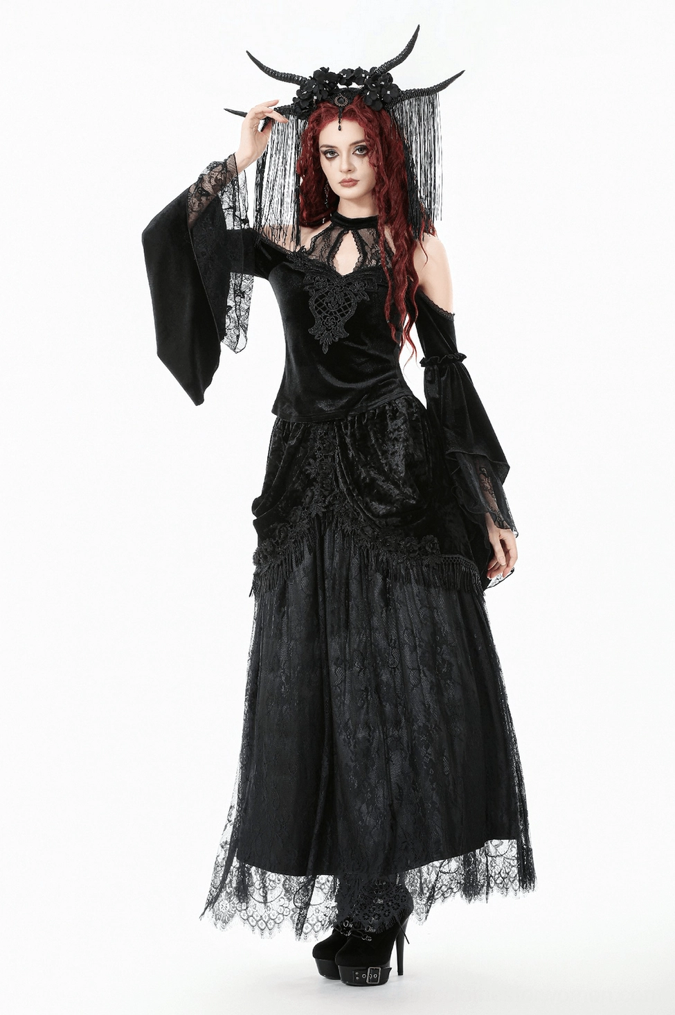 Detail shot of gothic black velvet lace maxi skirt showing high-waist elastic band and fabric quality
