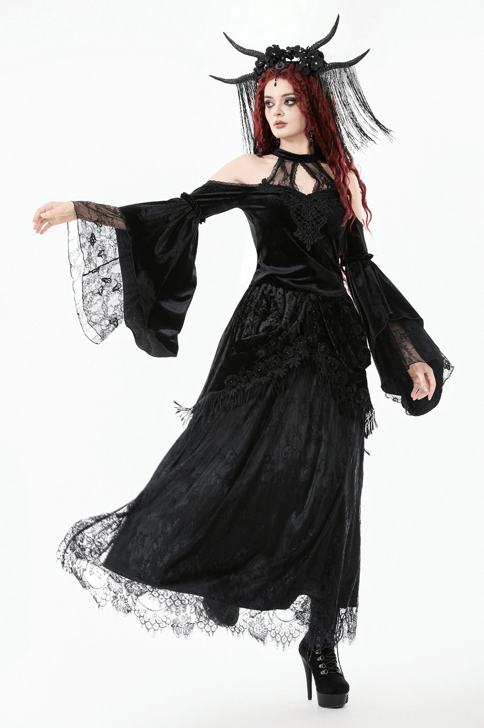 Gothic black velvet maxi skirt detail showing cascading ruffled panels and overall garment construction