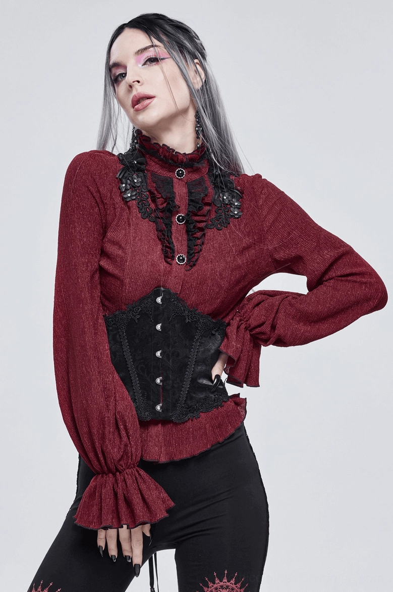 Alternative angle of wine red gothic blouse highlighting ruffled sleeves and overall silhouette
