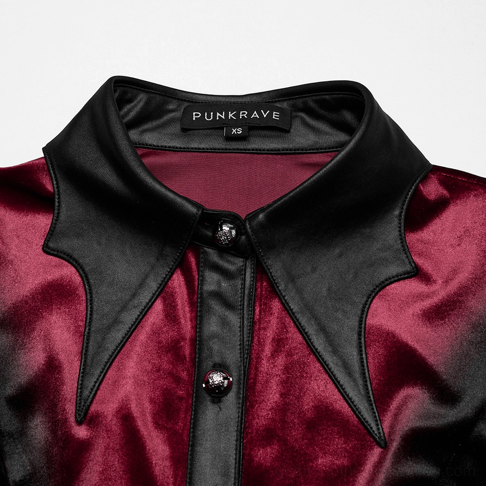 Close-up detail of bat wing leather collar with carved gemstone buttons on Gothic blouse