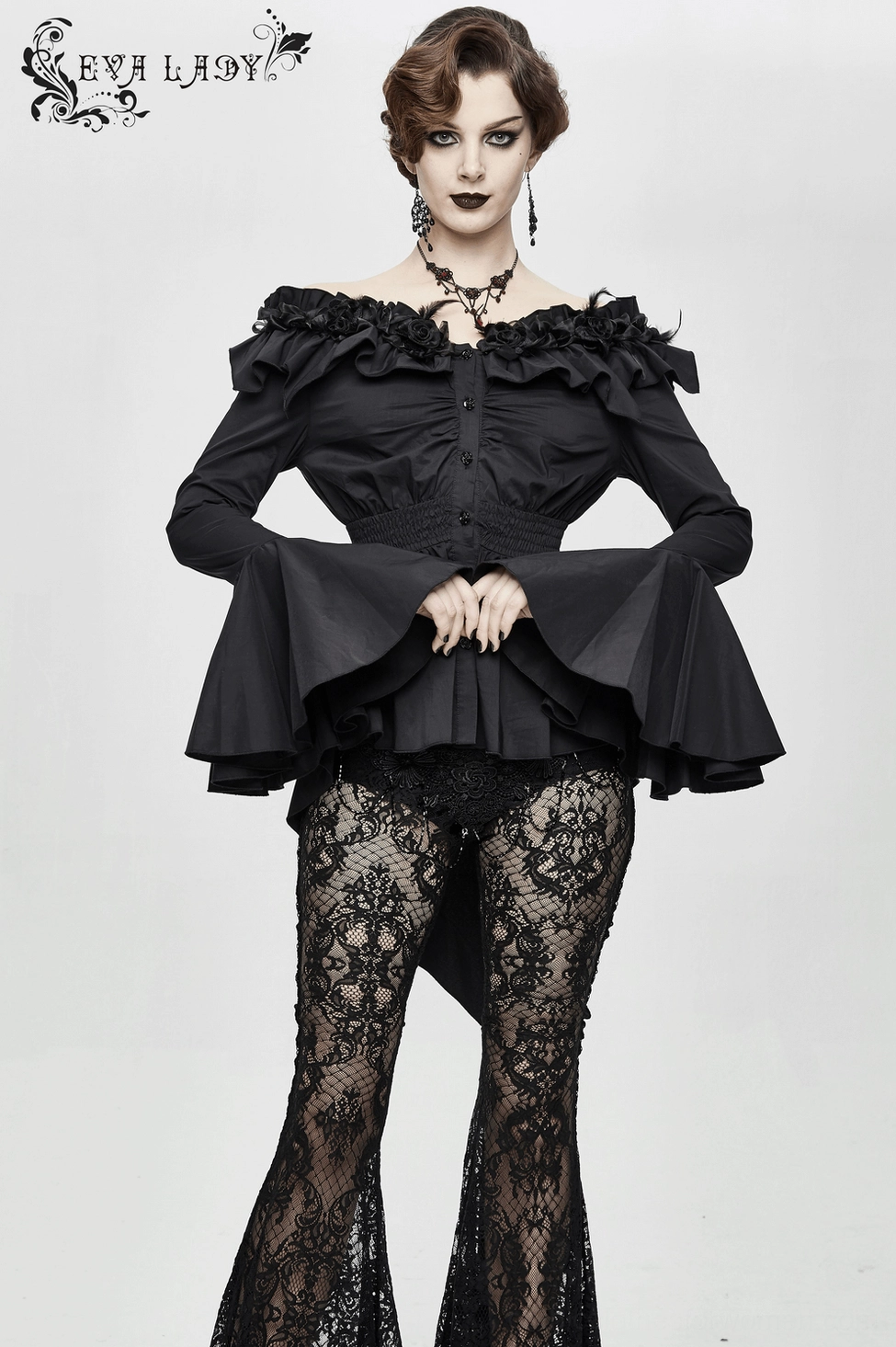 Gothic blouse detail showing bell flare sleeve construction, ruffled edge detailing, and fabric drape in movement on alternative fashion model