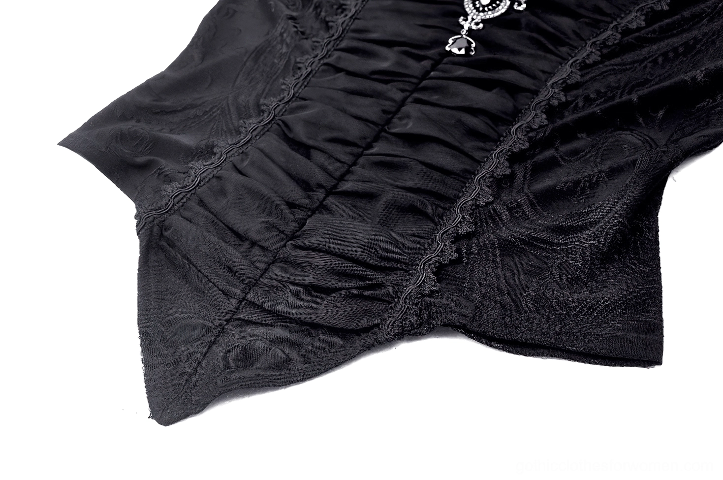 Bell sleeve close-up of black Victorian gothic blouse featuring ruffled cuff, flowing bell sleeve silhouette, and lace trim on black fabric background