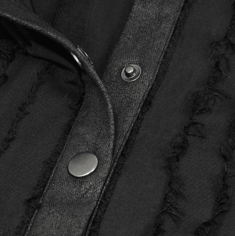 Front button placket detail of gothic blouse showing round metal snap buttons and faux leather trim