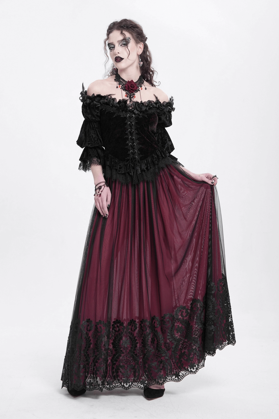 Flat lay detail of gothic off-shoulder velvet blouse showing ruffled collar construction and lace fastener system