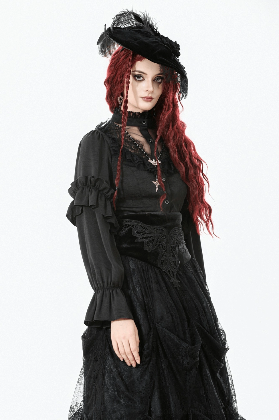Victorian gothic black blouse detail featuring stand collar, lace yoke and ruffled sleeve construction on flat lay