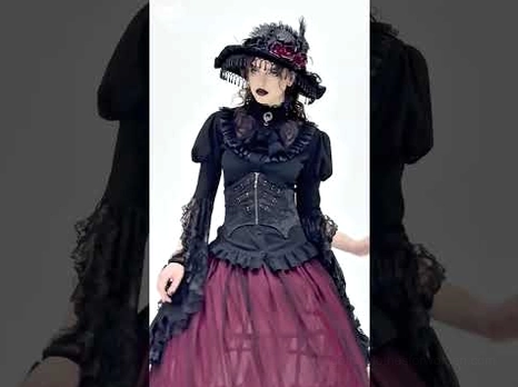Victorian gothic blouse styled with burgundy tulle skirt, corset waist, and decorative hat for complete ensemble