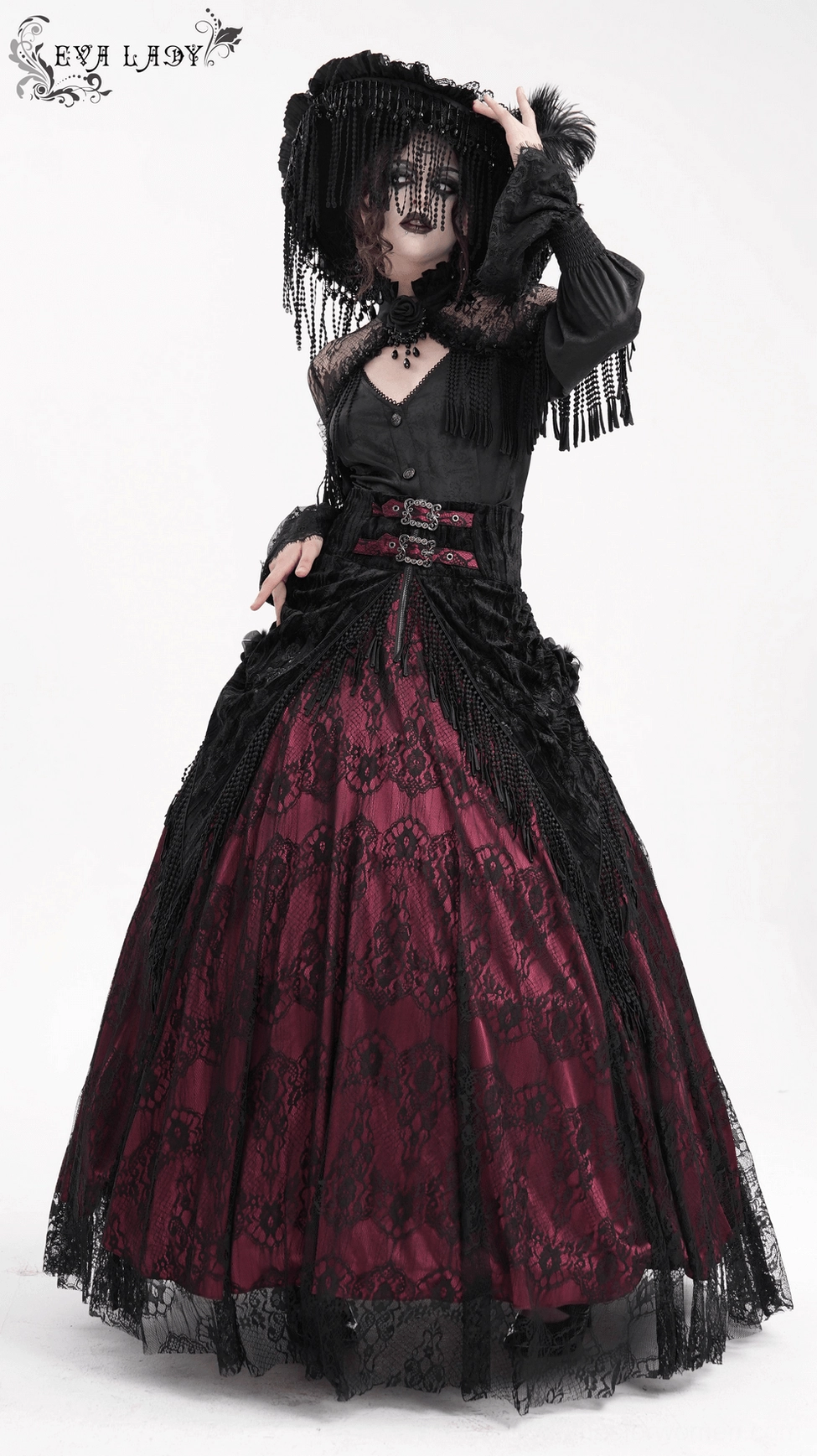 Victorian gothic blouse on form showing corset lace-up back, fringe details, and tailored fit construction from back perspective