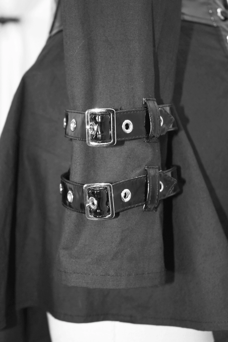 Cuff detail close-up - double leather buckles on black woven fabric sleeve