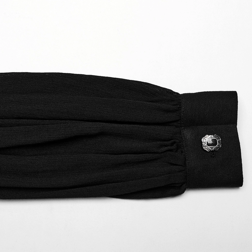 Gothic blouse cuff detail showing vintage metal button and pleated cuff fabric construction