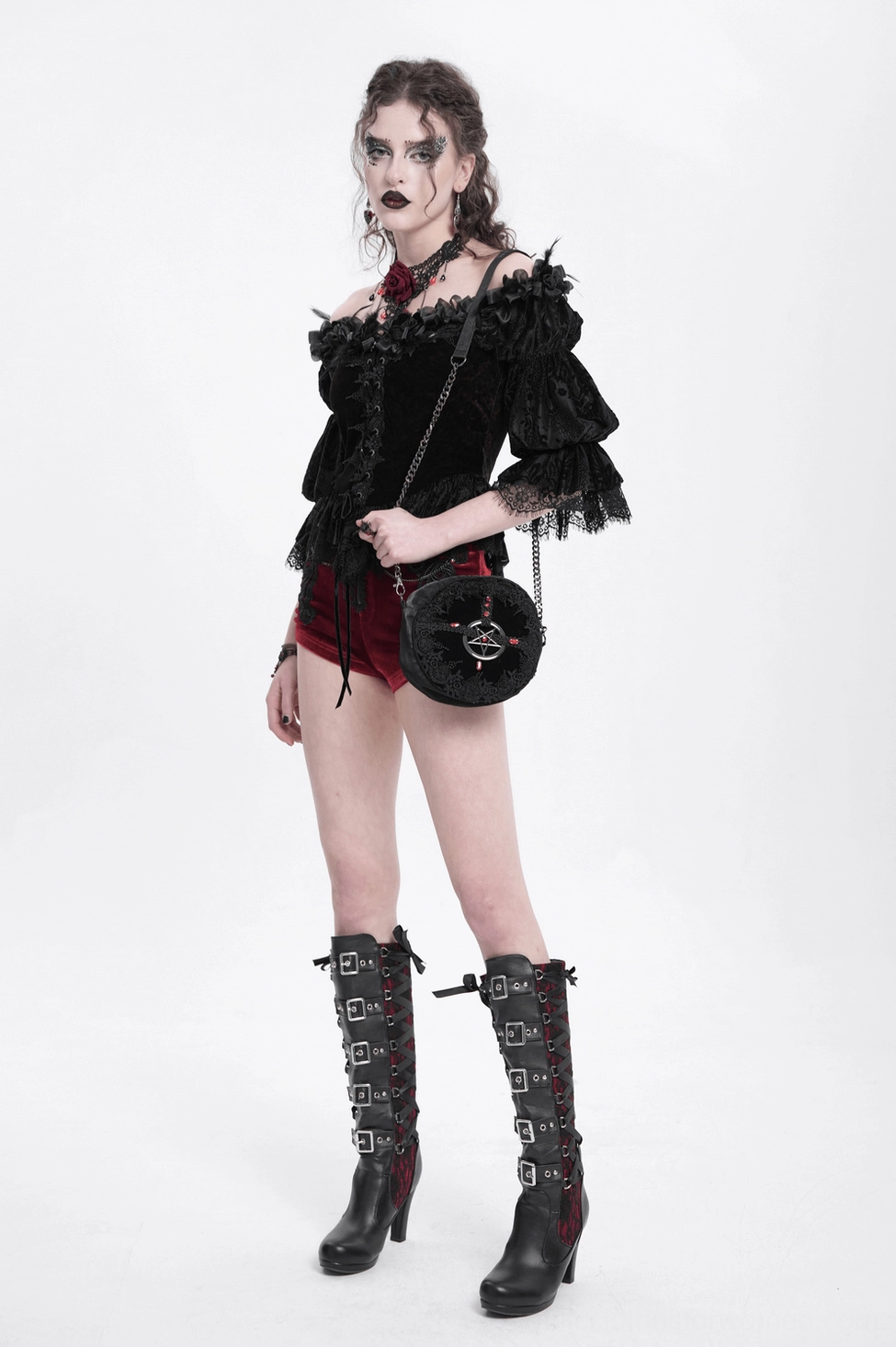 Close-up view of gothic off-shoulder blouse highlighting black lace accents and velvet ribbon eyelet details