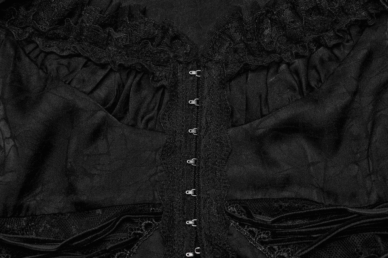 Gothic blouse construction detail showing dual-fabric composition and lace-to-woven transition