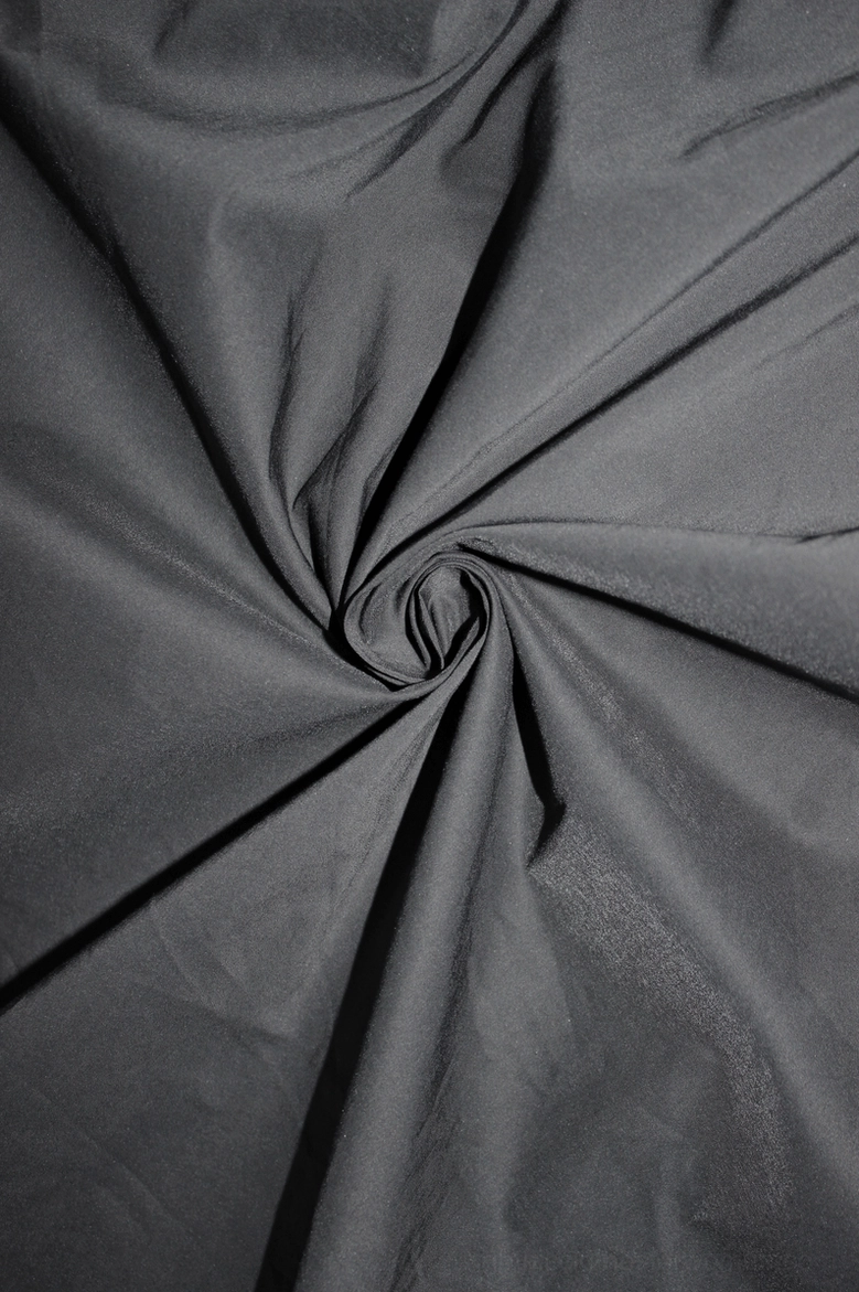 Fabric texture close-up of gothic blouse showing woven cotton-polyester blend, smooth surface finish, subtle sheen, and wrinkled texture detail