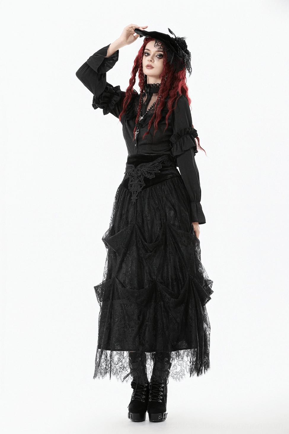 Alternative fashion gothic blouse showing front button closure, fitted bodice and theatrical ruffle sleeve styling