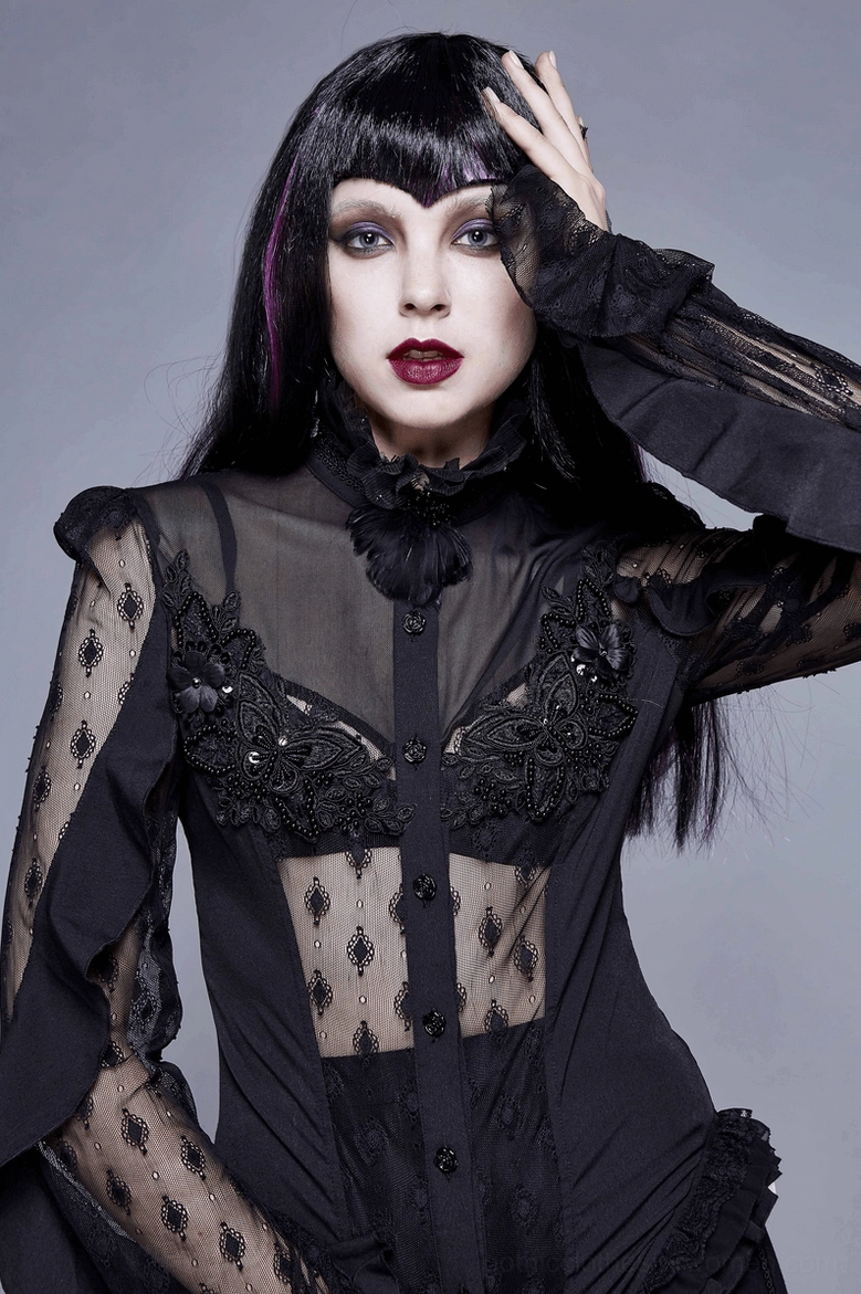 Close-up front view of gothic lace blouse showing sheer lace sleeves and embroidered bust appliqué on model
