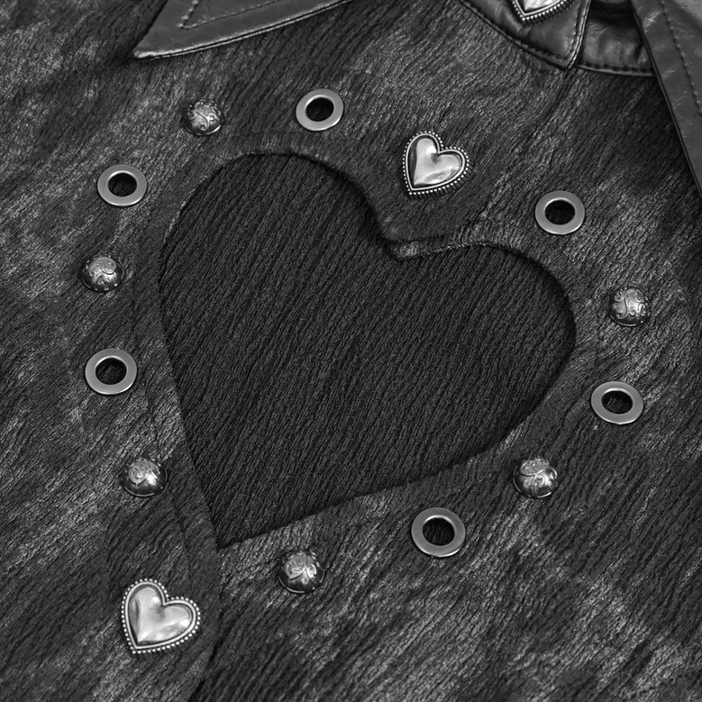 Macro close-up of black gothic blouse heart cutout with metal eyelets and decorative heart buttons