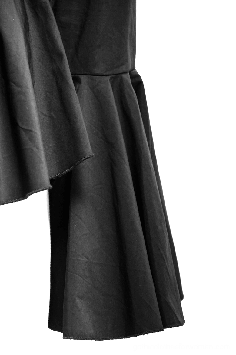 Detailed view of gothic blouse hem and cuff showing peplum ruffle construction, flare sleeve fabric weight, and tailored seam quality
