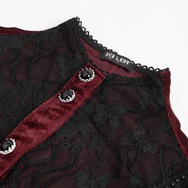 Close-up detail of jeweled buttons and gothic blouse neckline with stand collar design
