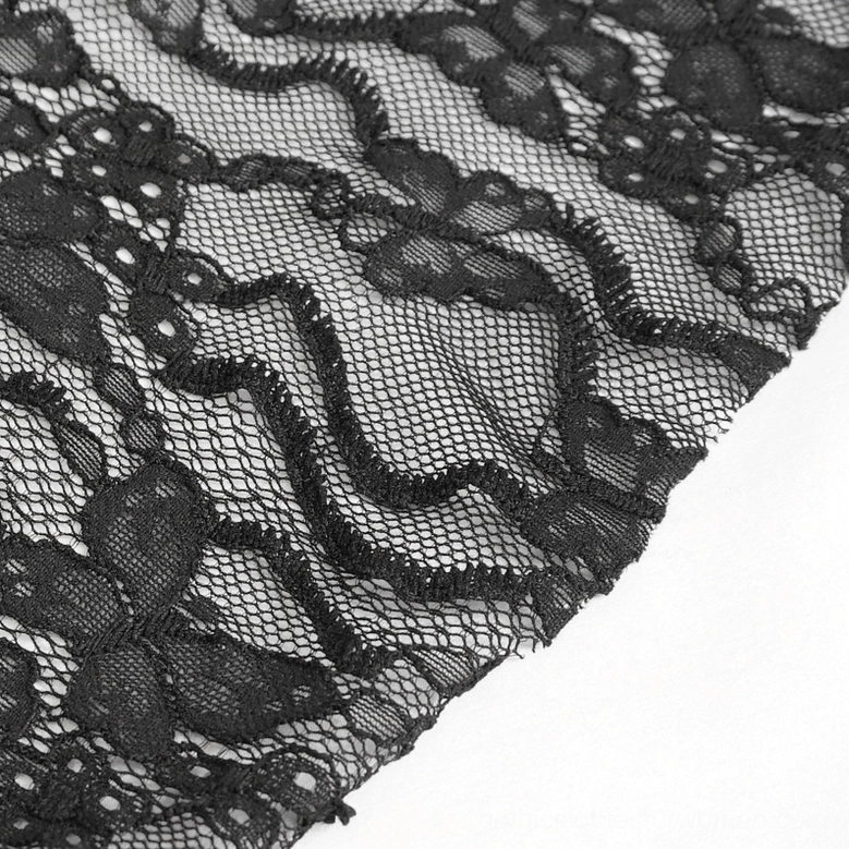 Close-up texture detail of black sheer floral lace from gothic blouse showing scalloped edges and delicate mesh base
