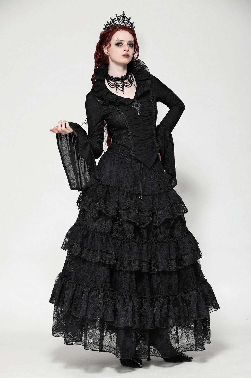 Black Victorian gothic long sleeve top detail shots highlighting lace trim accents, ruffled collar construction, and ornate filigree brooch decorative elements