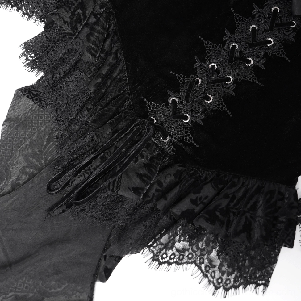 Close-up detail of black gothic blouse showing lace trim work, velvet texture, and decorative lace overlay elements