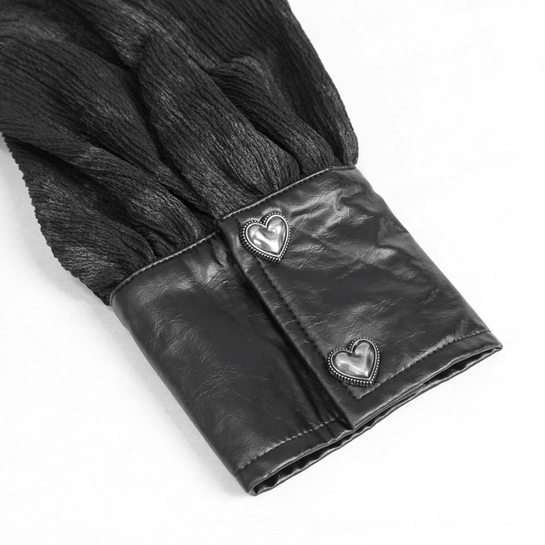 Detailed view of black gothic blouse wrist cuff featuring heart-shaped metal buttons and leather trim