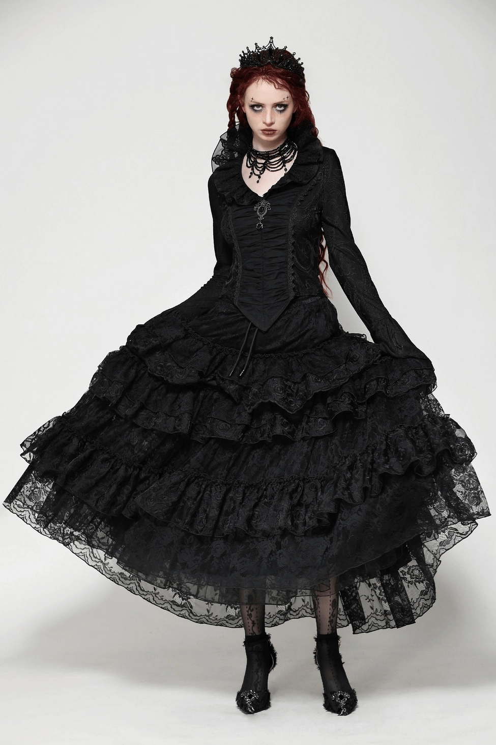 Texture and fabric detail of black Victorian gothic blouse showing super-elastic polyester-spandex blend, embroidered jacquard pattern, and premium construction quality