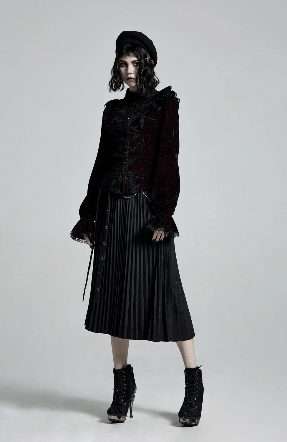 Velvet gothic blouse construction detail showing ruffled shoulders and neckline