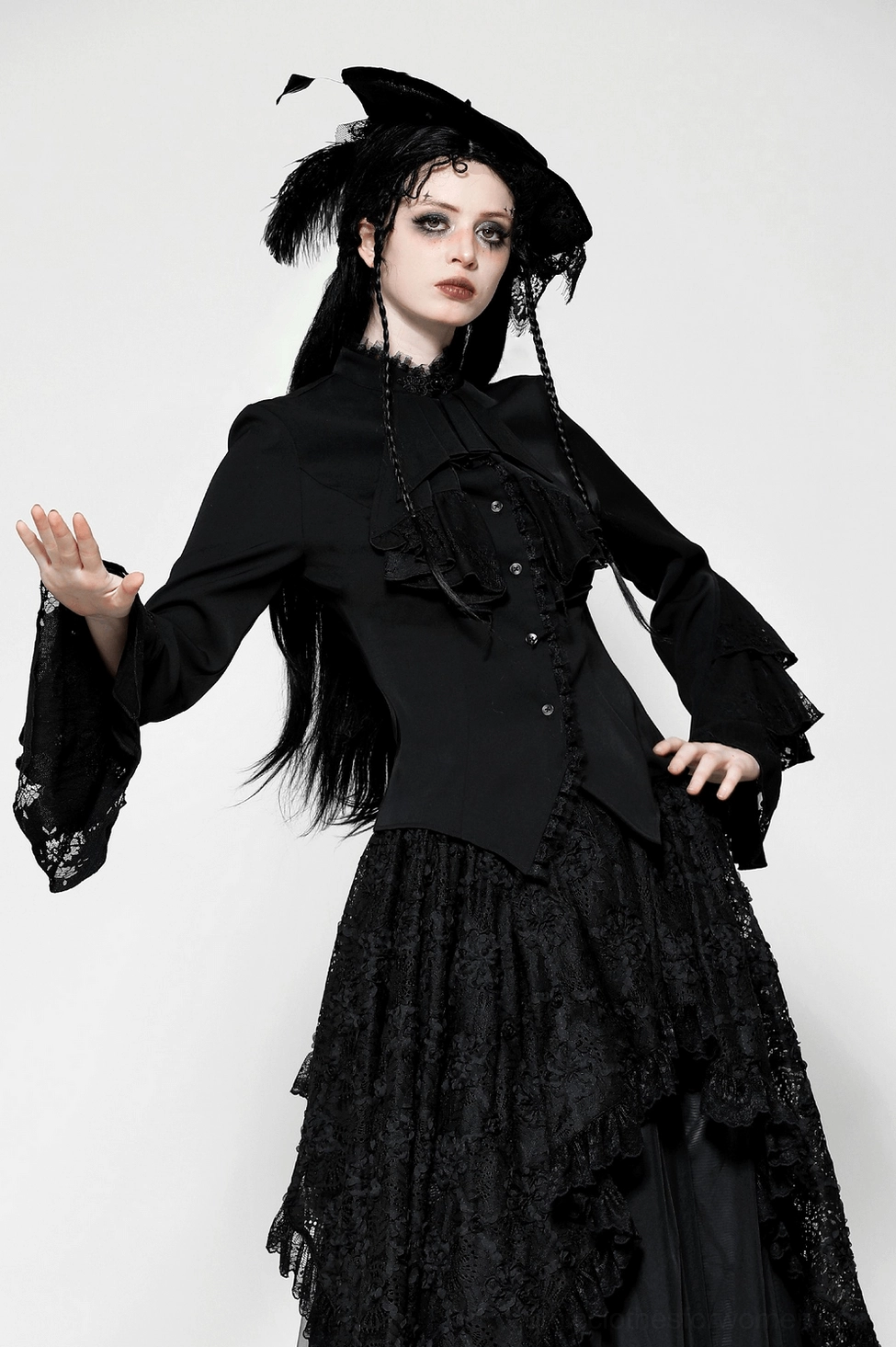Black Victorian gothic blouse detail view showing ruffle sleeve construction, lace embellishments, and fitted silhouette on model