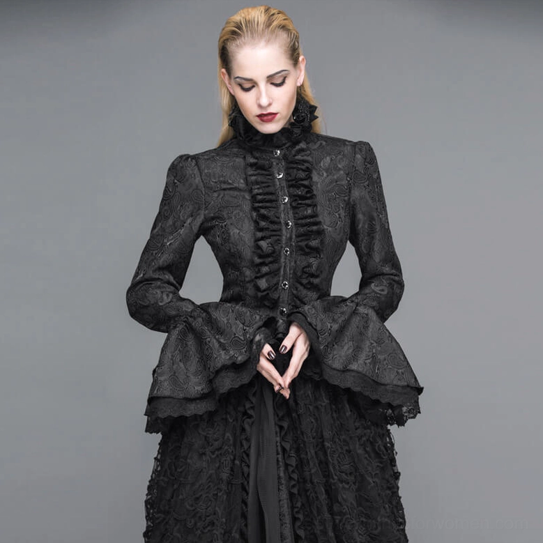 Black gothic lace blouse on blonde model showing ruffled front placket and architectural collar design